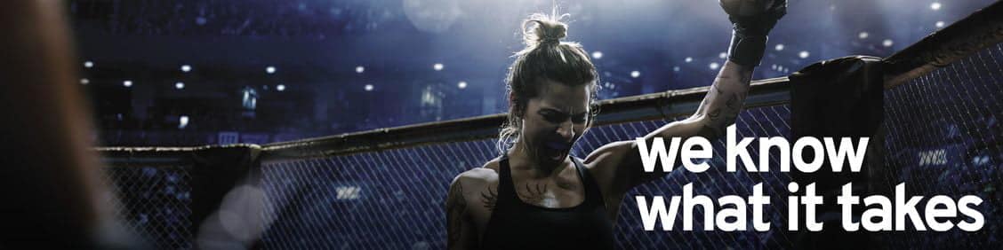 Image of a motivational banner with the text %22We know what it takes%22 next to a triumphant woman in a boxing ring.