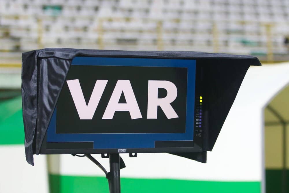 A picture of a VAR screen with stadium seats in the background.