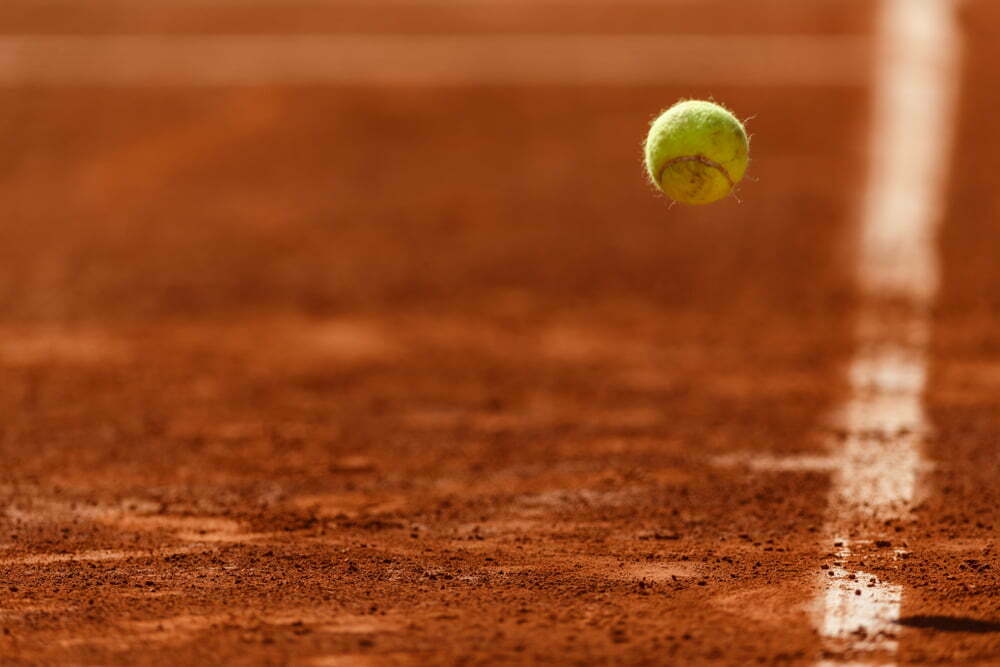 Bouncing,Tennis,Ball,On,Clay,Court